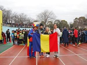 Runners with mayor showing Romanian national flag