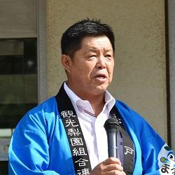 あいさつする高橋会長